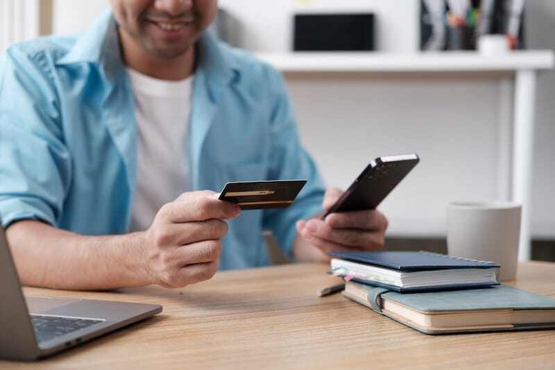 Man-holding-id-card-and-phone.jpg?width\u003d450\u0026height\u003d300\u0026name\u003dMan-holding-id-card-and-phone.jpg