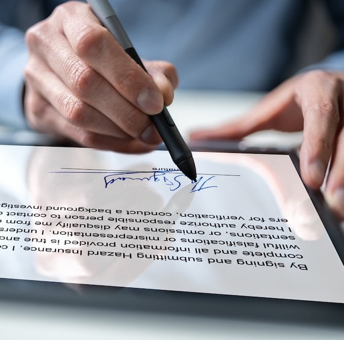 Person signing on tablet-2