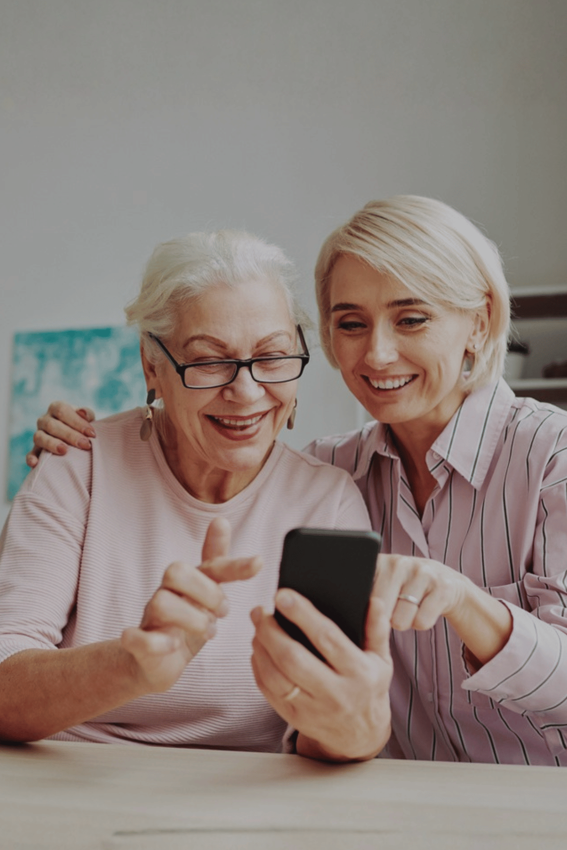 Two woman watching a phone-1