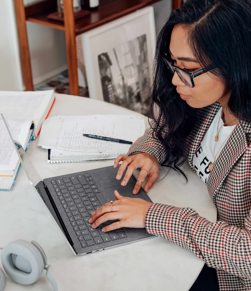Woman typing on laptop