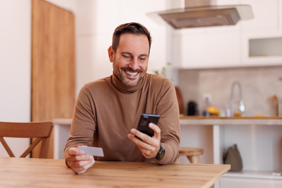 Man with phone and id card